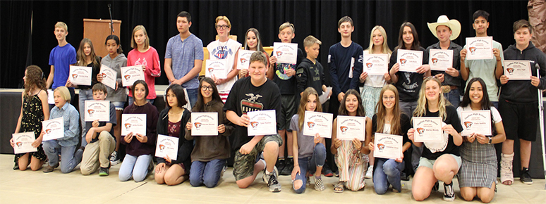 Student Athletes holding certificates