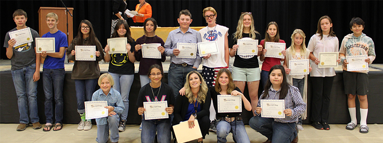 Students holding certificates